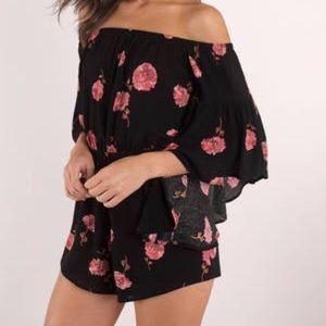What in Carnation romper in black